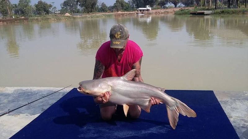 Khun Adrian, the park's first customer, with a catch