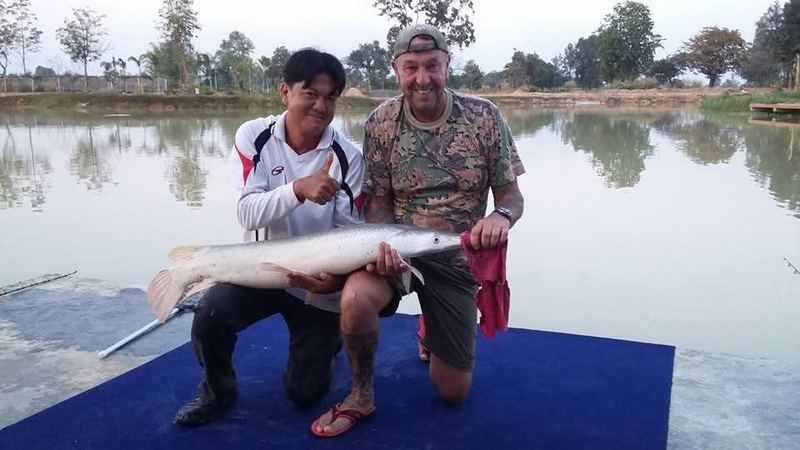 Khun Adrian and Win with an alligator gar