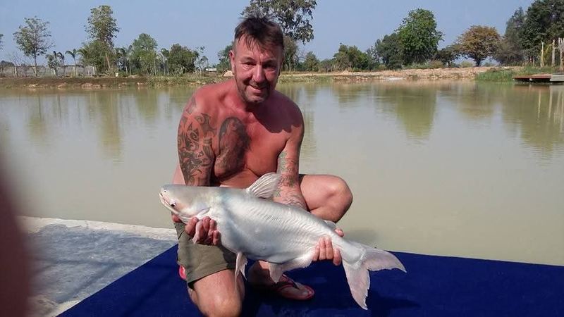 Khun Adrian with a striped catfish at the lake